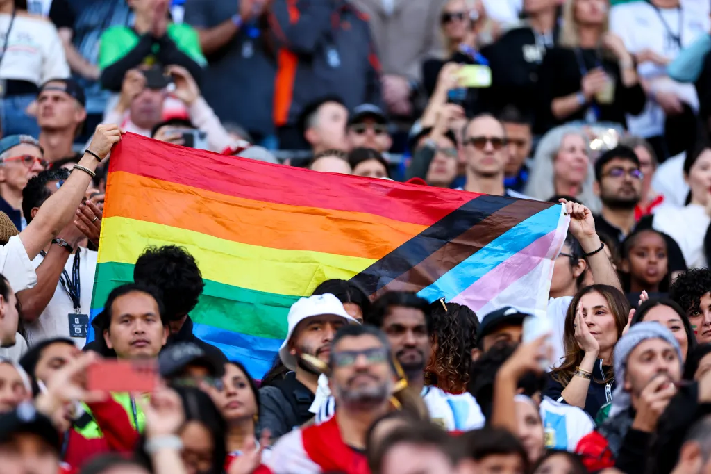 ans hold up a rainbow flag during the FIFA World Cup 2026 Group G match between Egypt and IR Iran at Seattle Stadium
