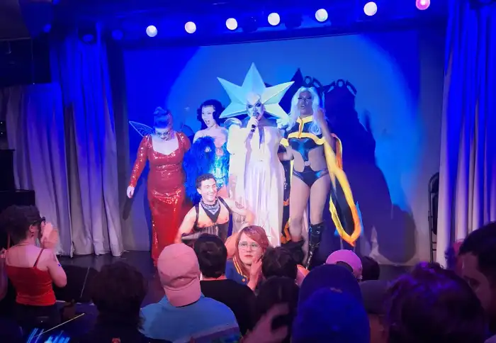 Performers on stage at FlameCon 2026.